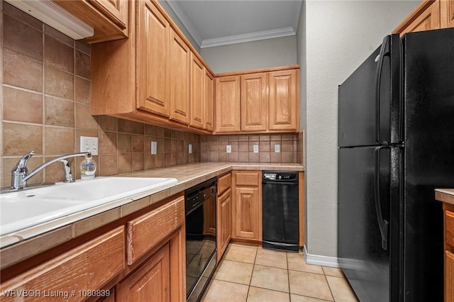 2808 May Branch Pt, Fort Smith, AR 72903 - kitchen with a sink, crown molding, black appliances, light countertops, and decorative backsplash