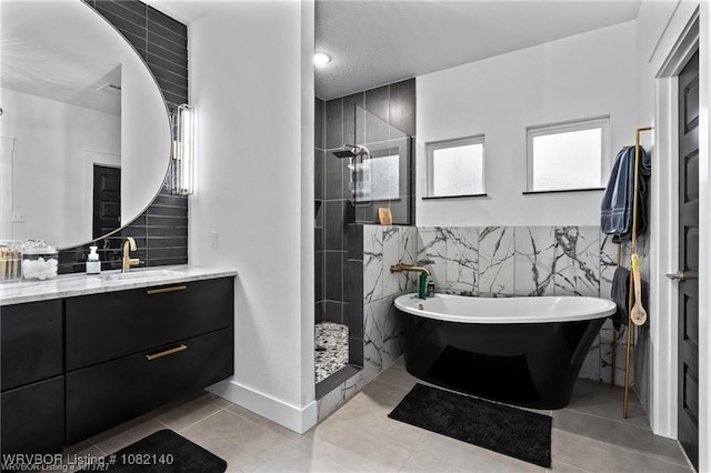 2205 Moody Rd, Barling, AR 72923 - full bathroom with tile walls, vanity, a freestanding tub, a walk in shower, and tile patterned floors
