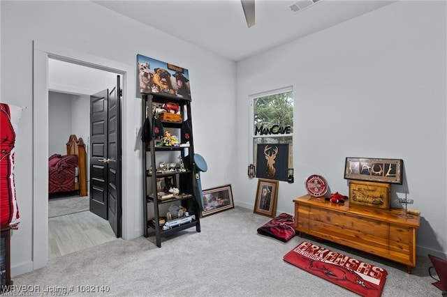2205 Moody Rd, Barling, AR 72923 - living area featuring carpet floors and a ceiling fan