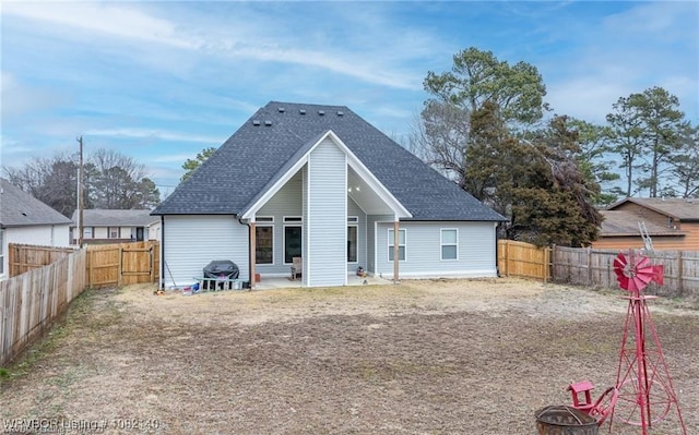 2205 Moody Rd, Barling, AR 72923 - rear view of property with roof with shingles, a fenced backyard, a fire pit, and a patio