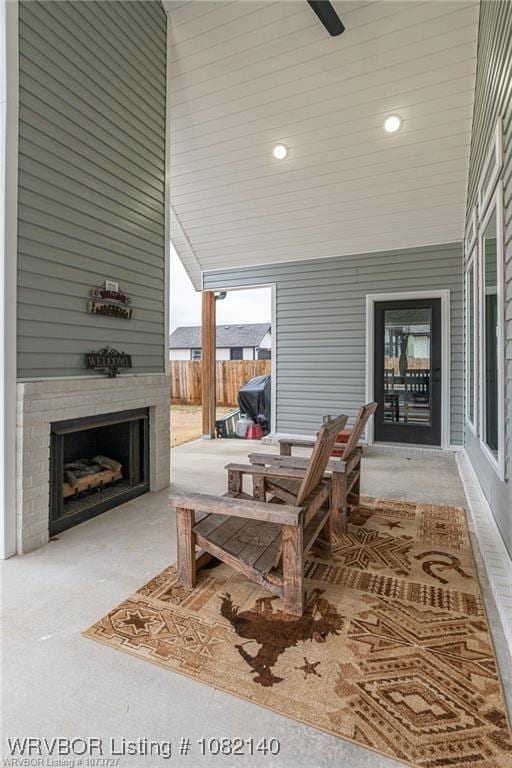 2205 Moody Rd, Barling, AR 72923 - view of patio / terrace with a fireplace and ceiling fan