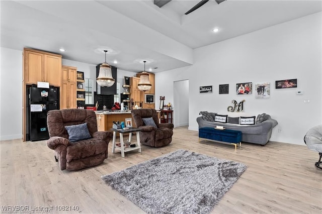 2205 Moody Rd, Barling, AR 72923 - living area with light wood-type flooring, ceiling fan, recessed lighting, and a towering ceiling