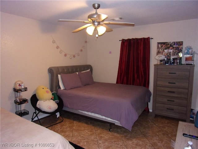 tiled bedroom featuring visible vents and ceiling fan