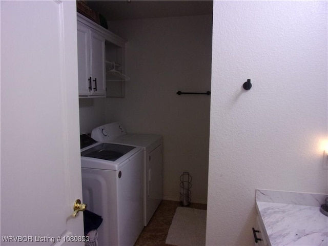 laundry area with cabinet space and washer and clothes dryer