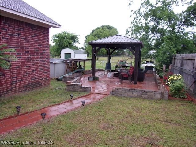 view of yard with a gazebo, a patio, and a fenced backyard