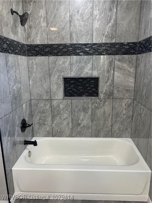 bathroom with shower / bathtub combination and visible vents