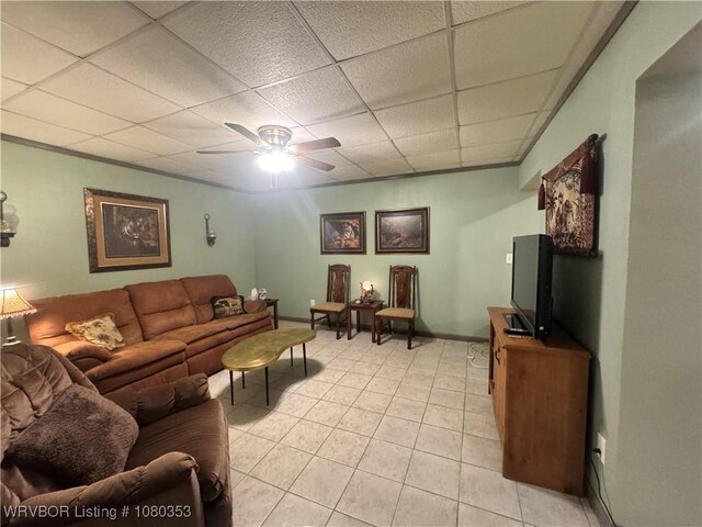 6538 110th Rd, Red Oak, OK 74563 - living room with ceiling fan, baseboards, a drop ceiling, and light tile patterned floors