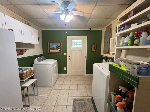 6538 110th Rd, Red Oak, OK 74563 - laundry area featuring a ceiling fan, separate washer and dryer, electric panel, light tile patterned floors, and cabinet space