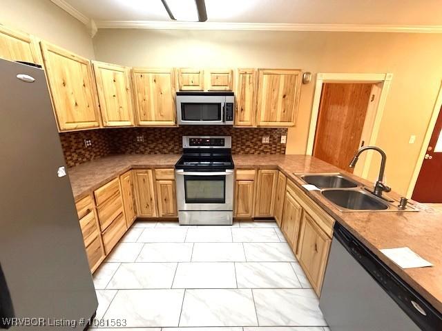 1434 W College St, Ozark, AR 72949 - kitchen with stainless steel appliances, a sink, ornamental molding, light marble finish flooring, and light brown cabinets