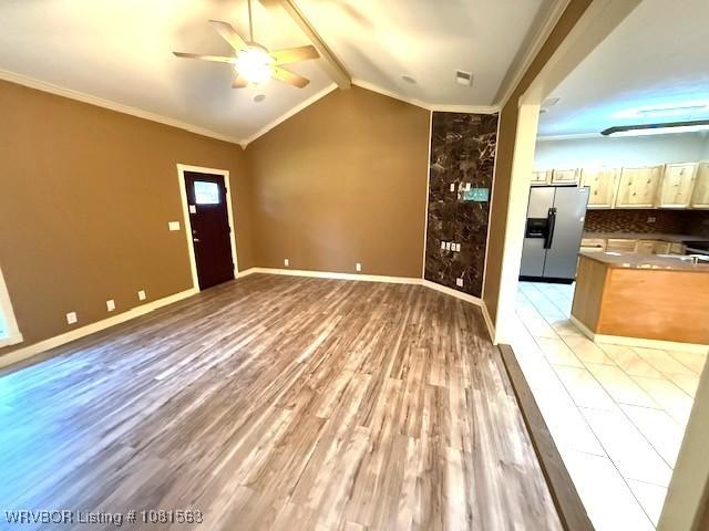 1434 W College St, Ozark, AR 72949 - unfurnished living room featuring ceiling fan, light wood-type flooring, ornamental molding, and baseboards