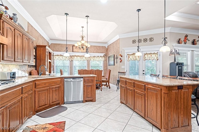 479872 E 1080th Rd, Muldrow, OK 74948 - kitchen featuring stainless steel appliances, brown cabinetry, a kitchen bar, a chandelier, and light stone countertops