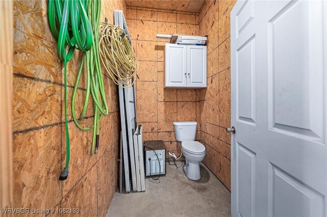 479872 E 1080th Rd, Muldrow, OK 74948 - bathroom featuring toilet and unfinished concrete flooring