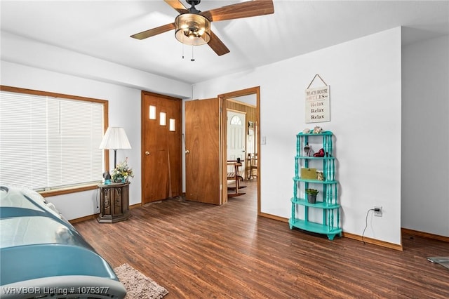 interior space featuring dark hardwood / wood-style flooring and ceiling fan