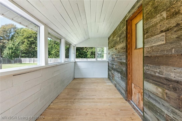 unfurnished sunroom with wooden ceiling and lofted ceiling