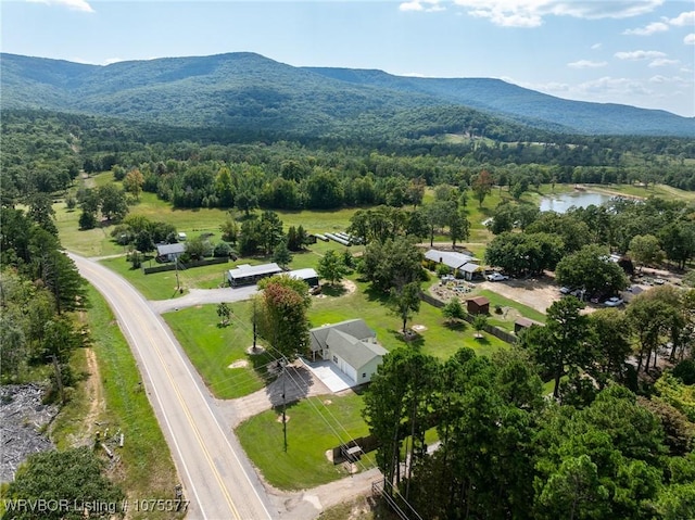 birds eye view of property featuring a water and mountain view