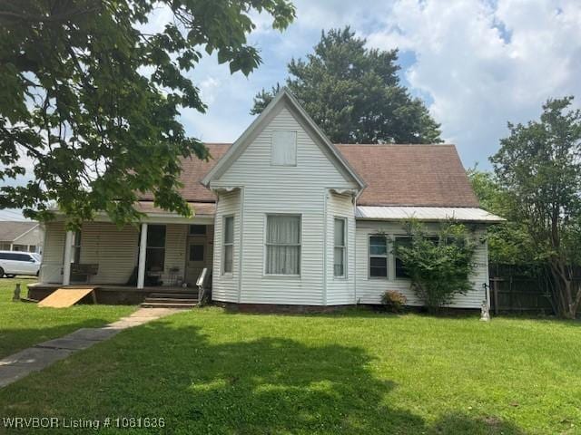 24 S 3rd St, Paris, AR 72855 - back of property featuring covered porch and a lawn