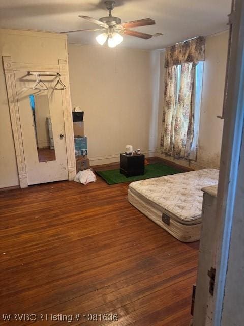 24 S 3rd St, Paris, AR 72855 - bedroom featuring wood finished floors and a ceiling fan