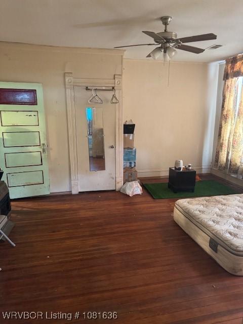 24 S 3rd St, Paris, AR 72855 - entrance foyer with dark wood finished floors and a ceiling fan