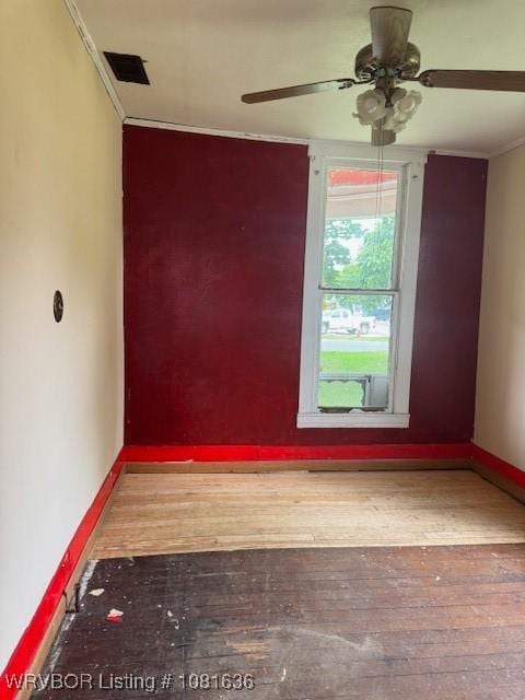 24 S 3rd St, Paris, AR 72855 - empty room with ornamental molding, hardwood / wood-style flooring, and a ceiling fan
