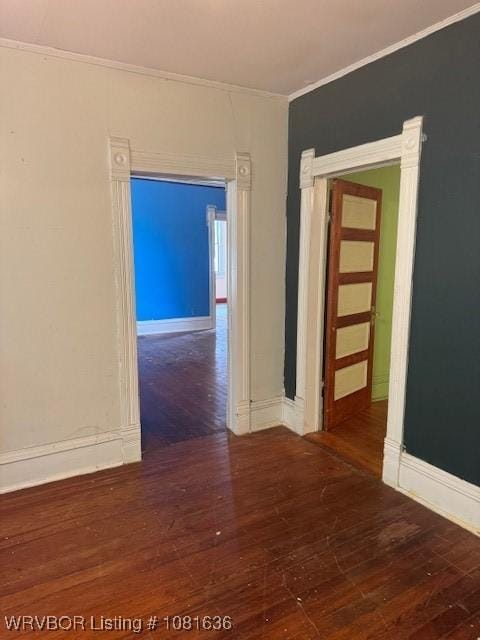 24 S 3rd St, Paris, AR 72855 - unfurnished room with hardwood / wood-style flooring and crown molding
