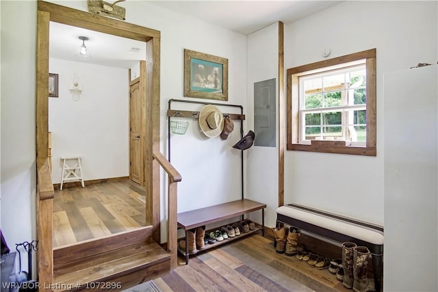 mudroom featuring wood-type flooring and electric panel