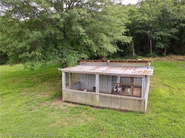 view of outdoor structure featuring a yard