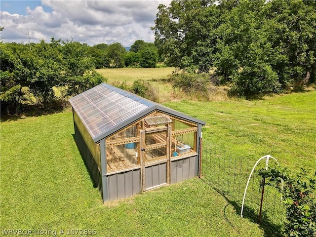 view of outdoor structure featuring a yard