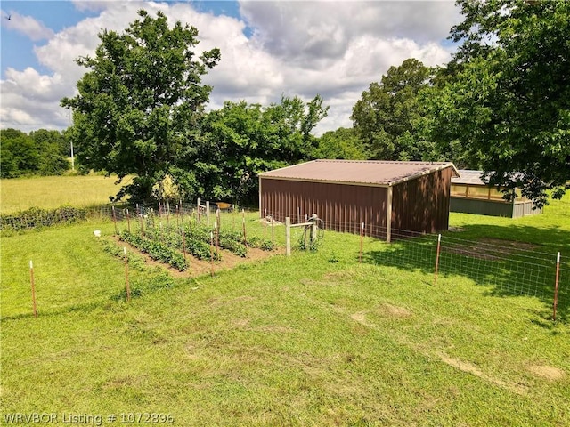 view of yard with a rural view