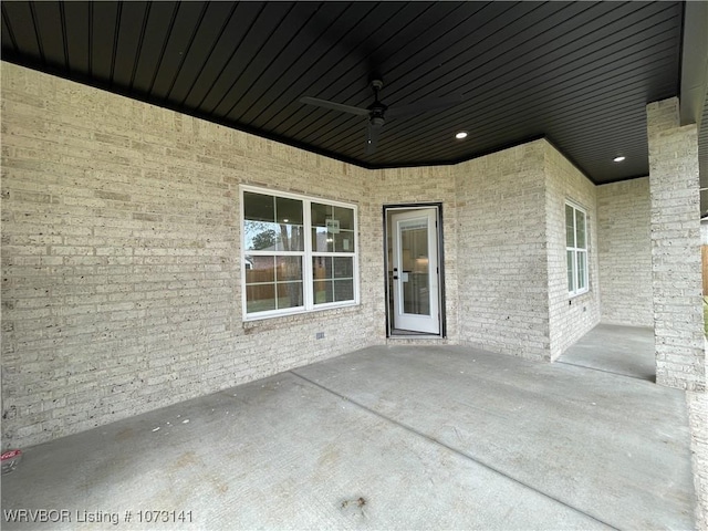 view of patio featuring ceiling fan