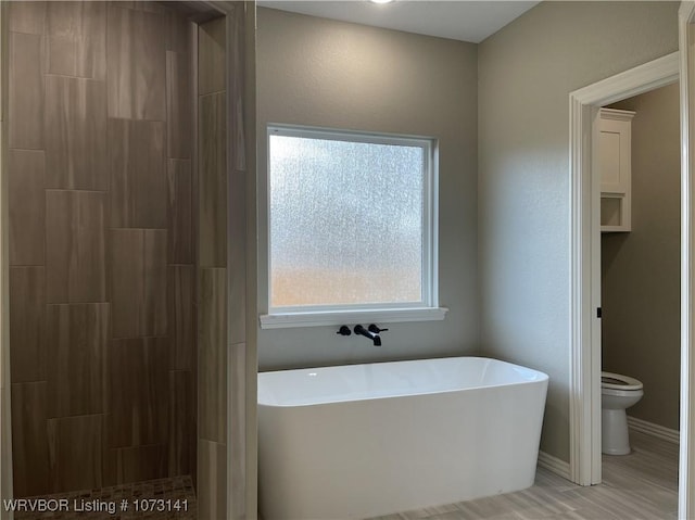 bathroom with separate shower and tub and toilet