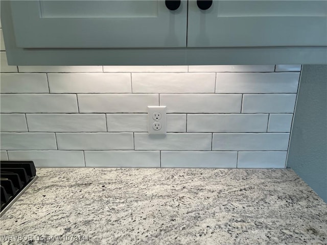 interior details featuring light stone countertops