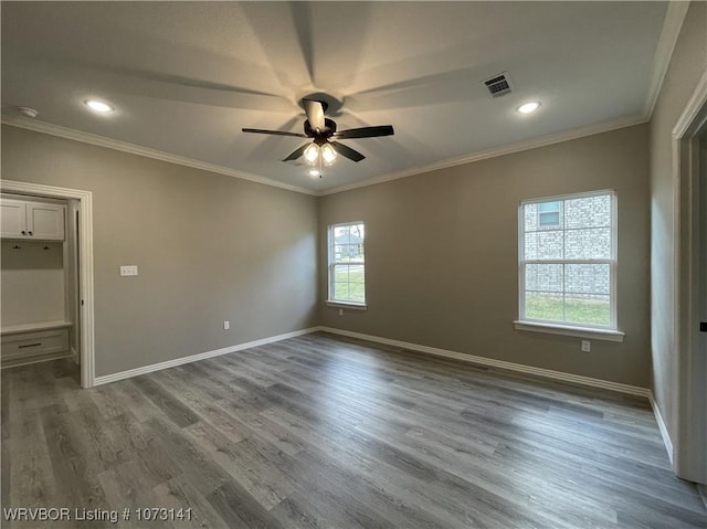 unfurnished room featuring ceiling fan, crown molding, and wood-type flooring