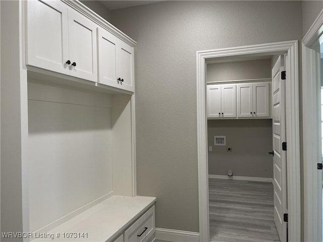 mudroom with light hardwood / wood-style flooring