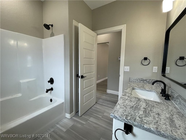 bathroom with shower / tub combination and vanity