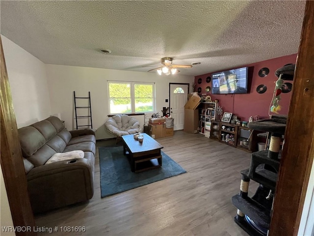 13824 Grober Hill Way, Fort Smith, AR 72916 - living room with ceiling fan, wood finished floors, and a textured ceiling