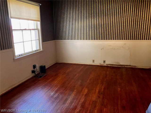 unfurnished room featuring hardwood / wood-style flooring