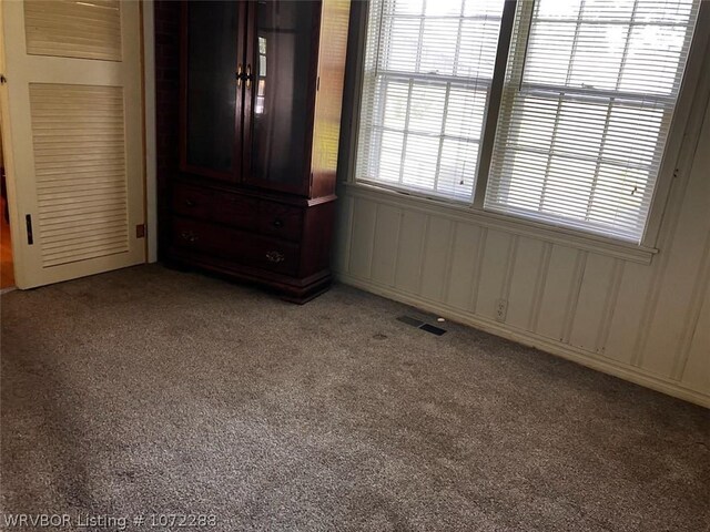 unfurnished bedroom with carpet floors