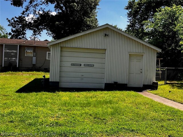 garage featuring a yard