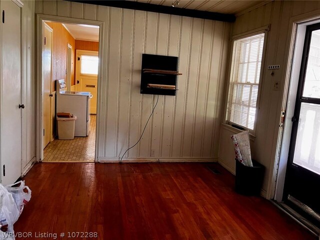 interior space featuring hardwood / wood-style floors, a healthy amount of sunlight, and washer / dryer