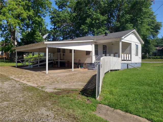 exterior space featuring a carport