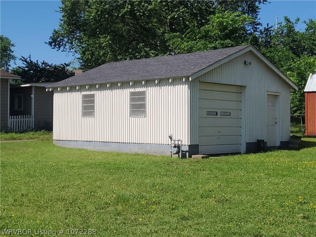 garage with a yard