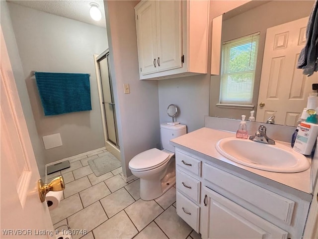 2114 Breckenridge Ter, Greenwood, AR 72936 - full bath featuring an enclosed shower, toilet, vanity, and tile patterned flooring