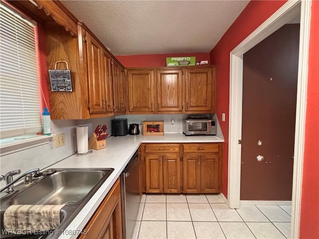 2114 Breckenridge Ter, Greenwood, AR 72936 - kitchen featuring a sink, dishwasher, brown cabinets, and a textured ceiling