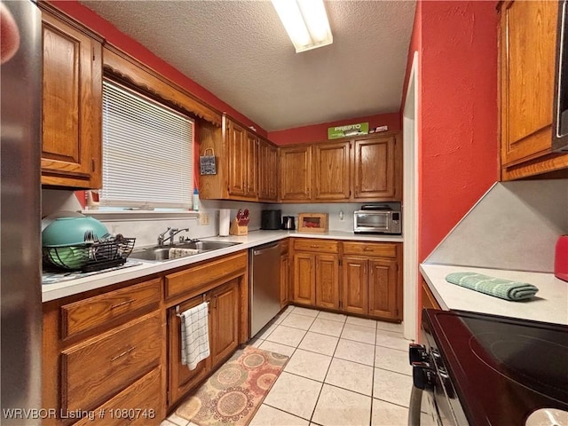 2114 Breckenridge Ter, Greenwood, AR 72936 - kitchen featuring stainless steel dishwasher, a sink, electric range oven, light countertops, and brown cabinets