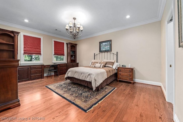 bedroom with hardwood / wood-style floors, crown molding, and a notable chandelier