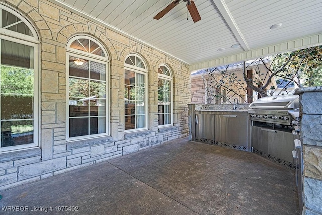 view of patio / terrace featuring grilling area, ceiling fan, sink, and area for grilling