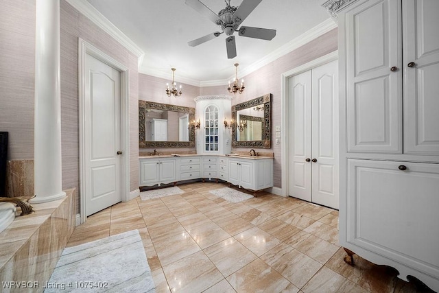 bathroom with tasteful backsplash, decorative columns, vanity, ceiling fan with notable chandelier, and ornamental molding