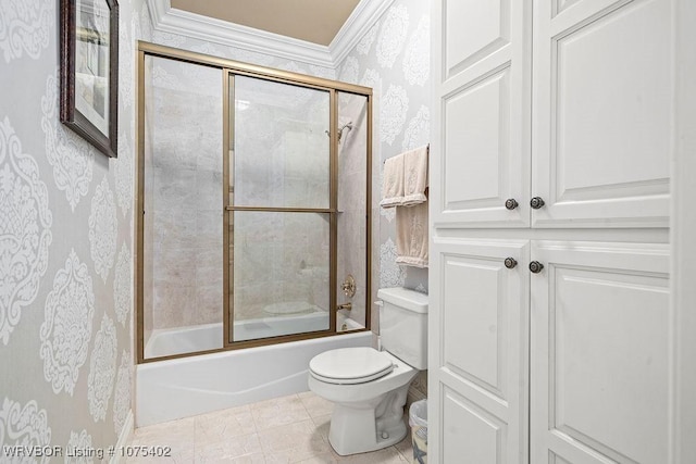 bathroom with tile patterned floors, toilet, and enclosed tub / shower combo