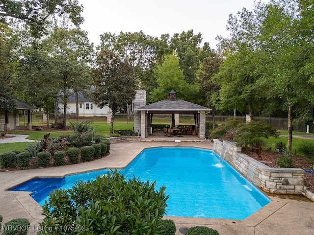 view of pool with a gazebo and pool water feature