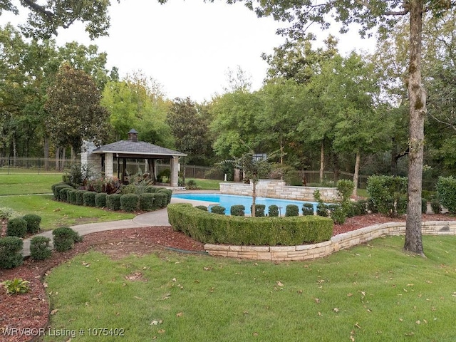 view of pool with a gazebo and a yard